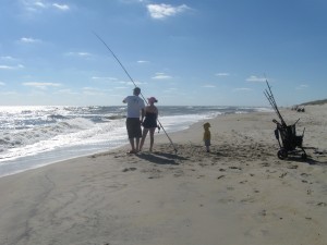 Photo of Lawrence and his step daughter along with Lawrence’s youngest surf fishing