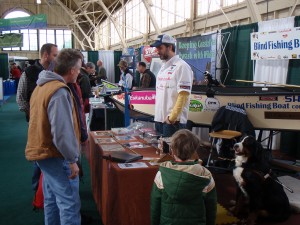 Photo of people visiting Lawrence and Maestro at the Blind Fishing Boat exhibit